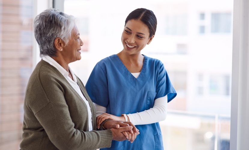 Shot of a young nurse caring for a senior woman